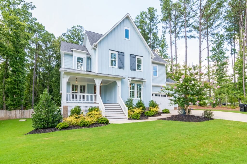 Blue House on Green Lawn